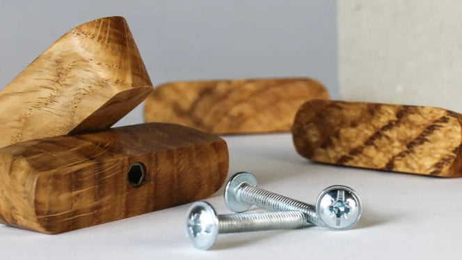 Alt Text: Set of wooden drawer knobs with a smooth natural finish.