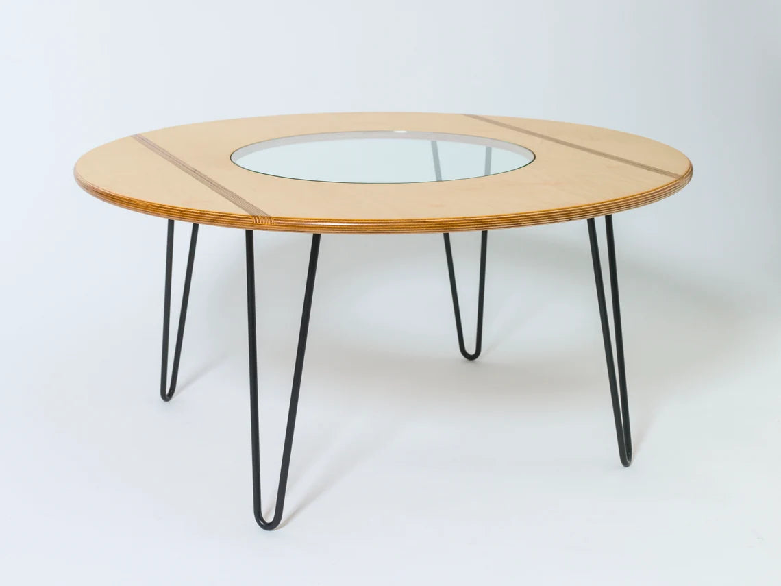 Plywood table with a mid-century modern aesthetic, blending style and functionality.