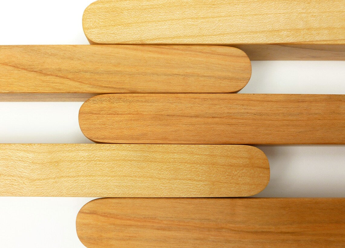 Handmade wooden handles for kitchen cabinets in custom sizes.