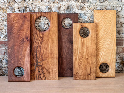 Olive wood board used as a cheese and charcuterie serving platter.