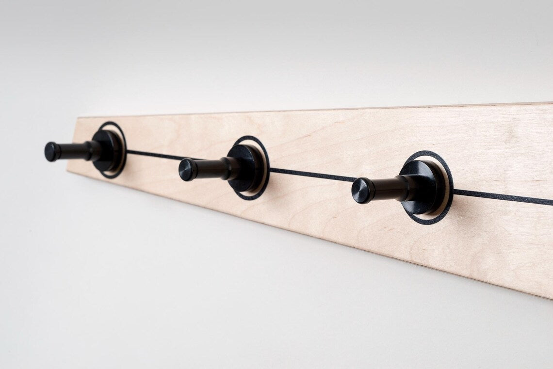 Handmade coat hooks crafted from premium Baltic Birch plywood with durable aluminum posts.