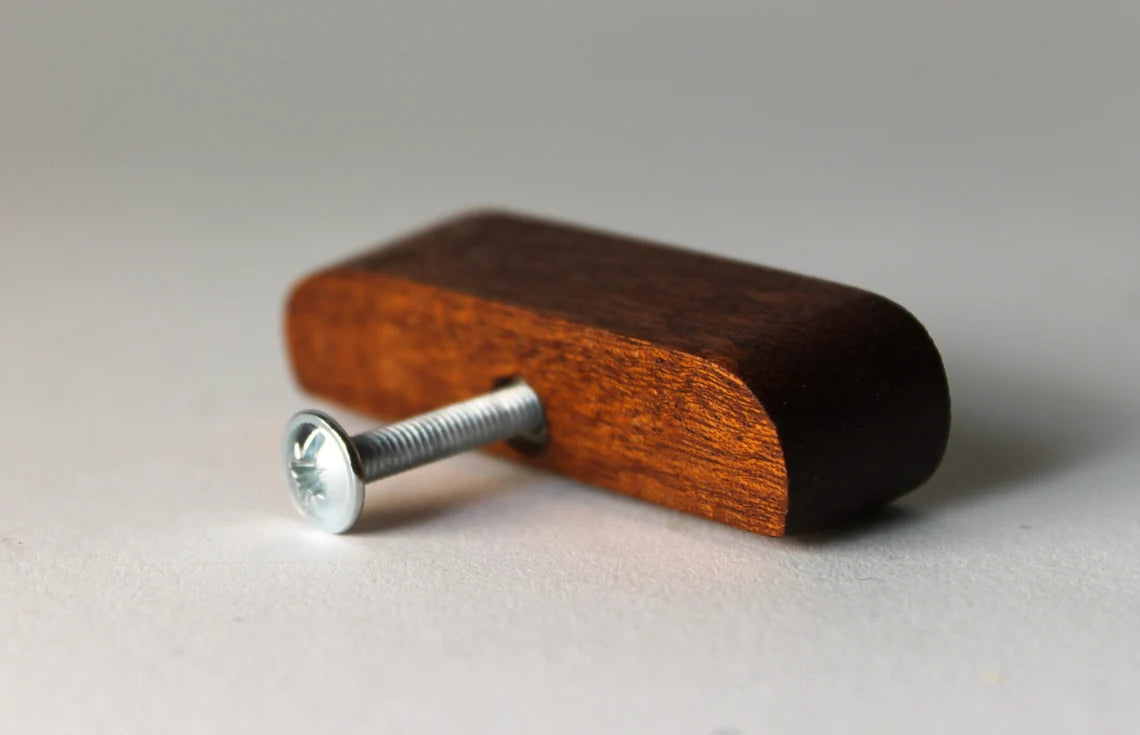 Alt Text: Minimalist wooden drawer knob for a sleek modern style.

