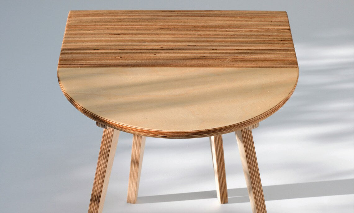 Stylish wooden table for modern homes, ideal for bedside or café use