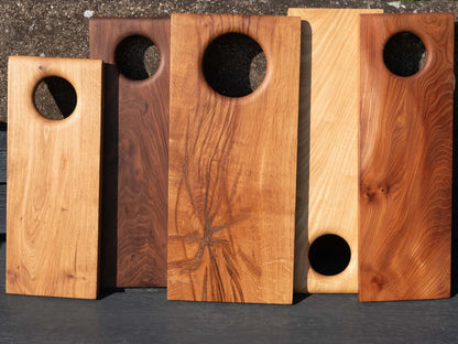 Natural wood cutting board treated with beeswax and mineral oil.