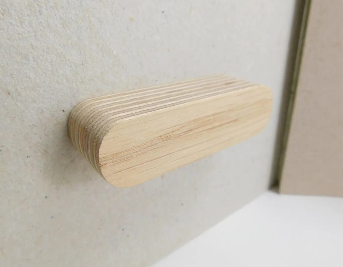 Pale white oak furniture handle with rounded edges