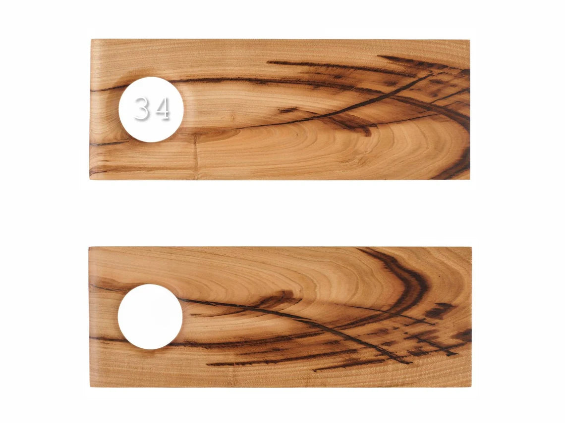 Custom engraved olive wood cutting board for kitchen or gift use.