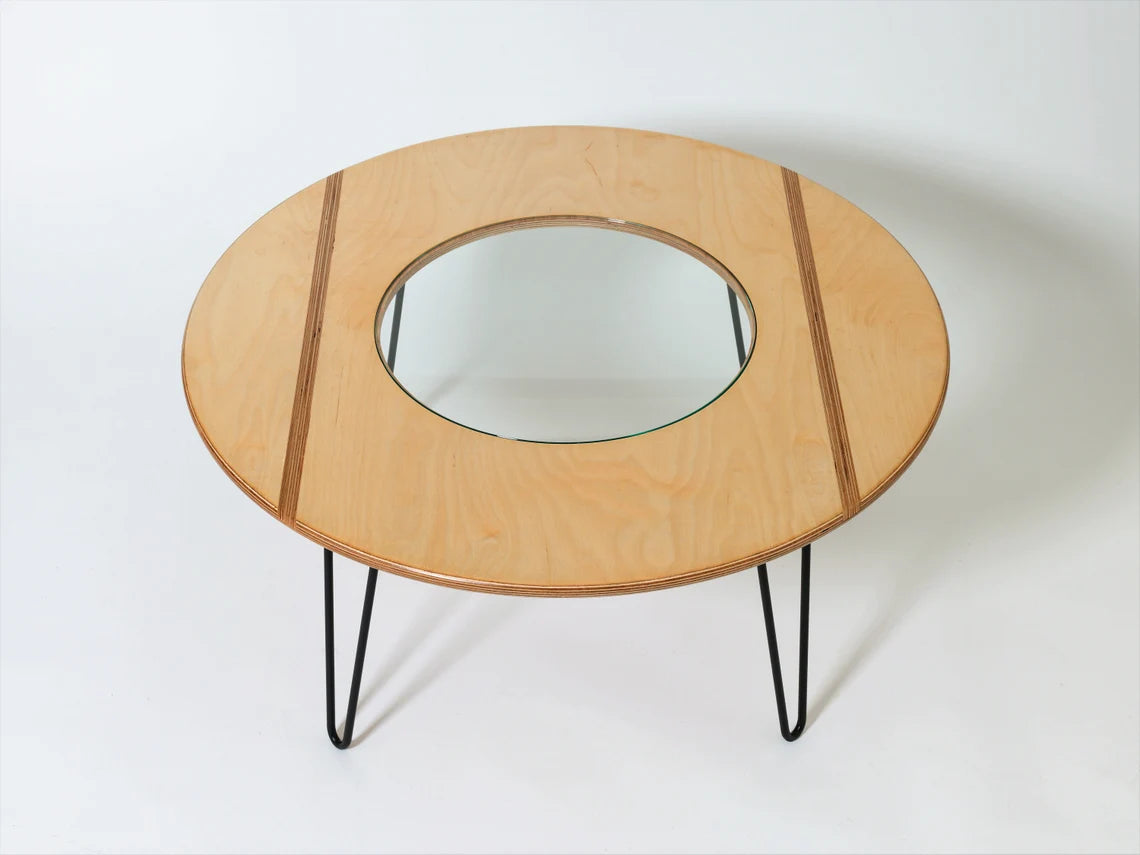 Contemporary round coffee table, perfect for modern living rooms.