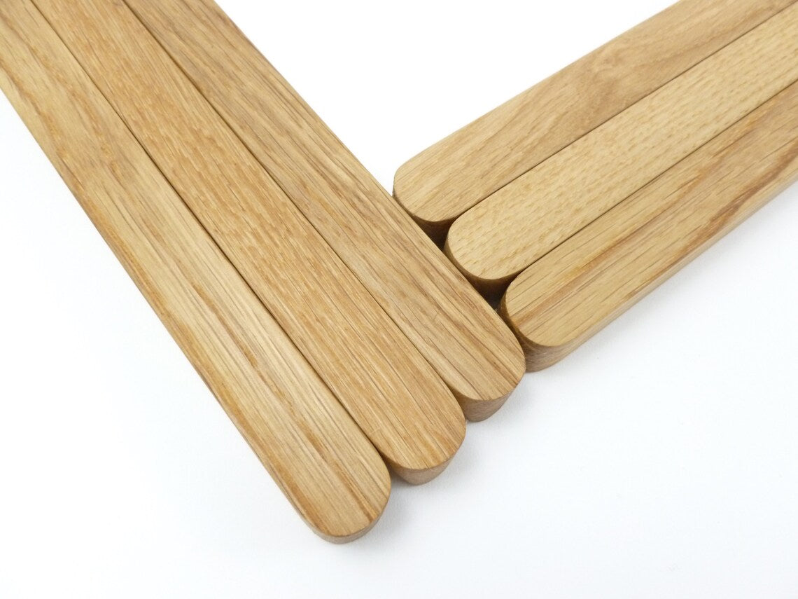 Natural wood-tone solid oak kitchen handle for modern décor.