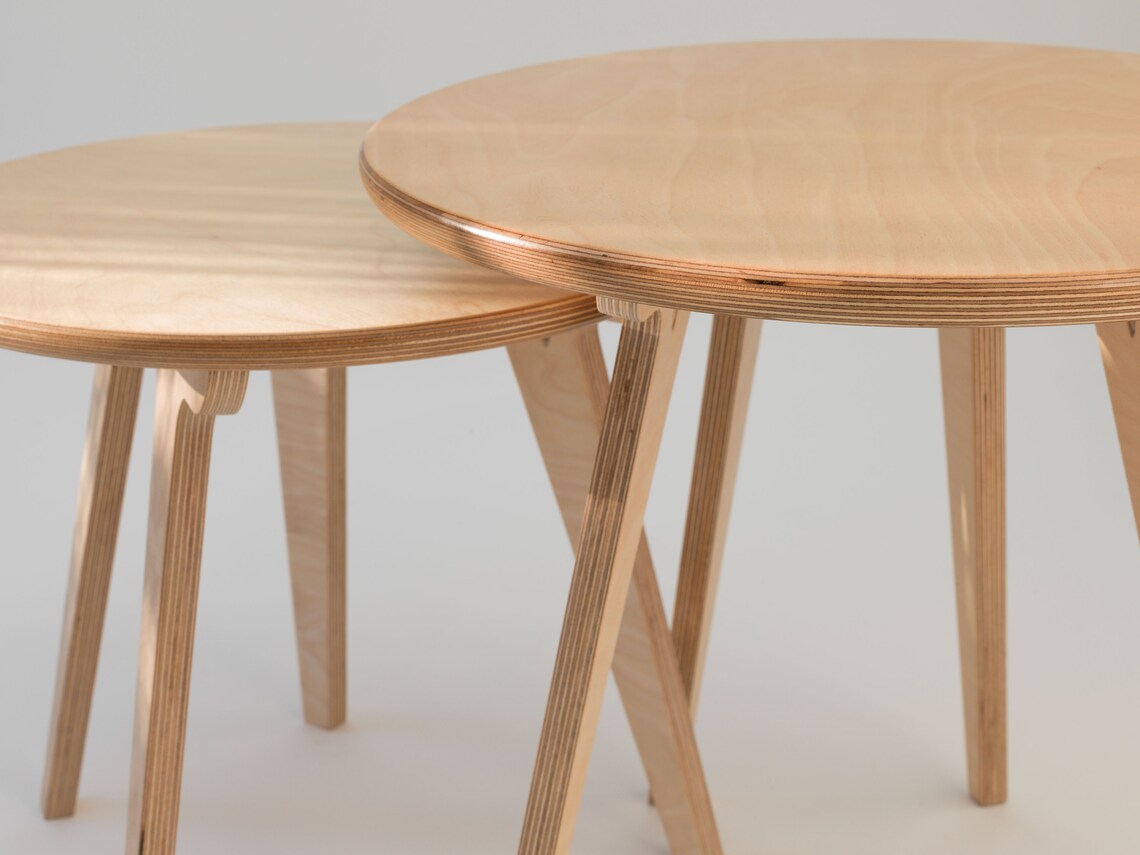 Round nesting coffee tables designed for space-saving elegance