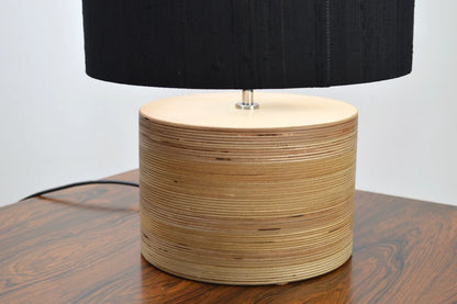 Stylish wooden bedside table lamp, perfect for cozy bedroom lighting.